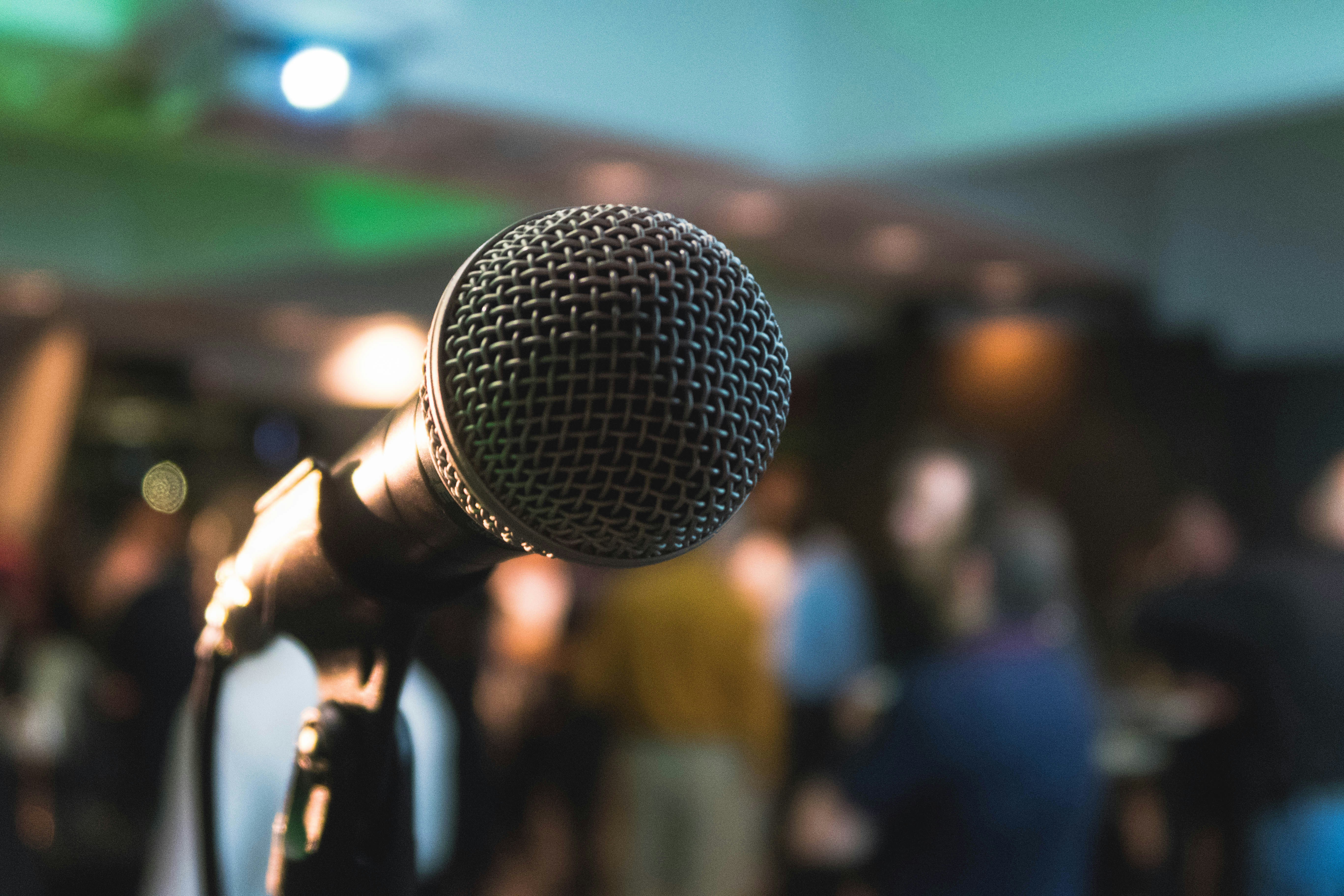 Photograph of a microphone, seemingly set up at a podium ahead of a speech