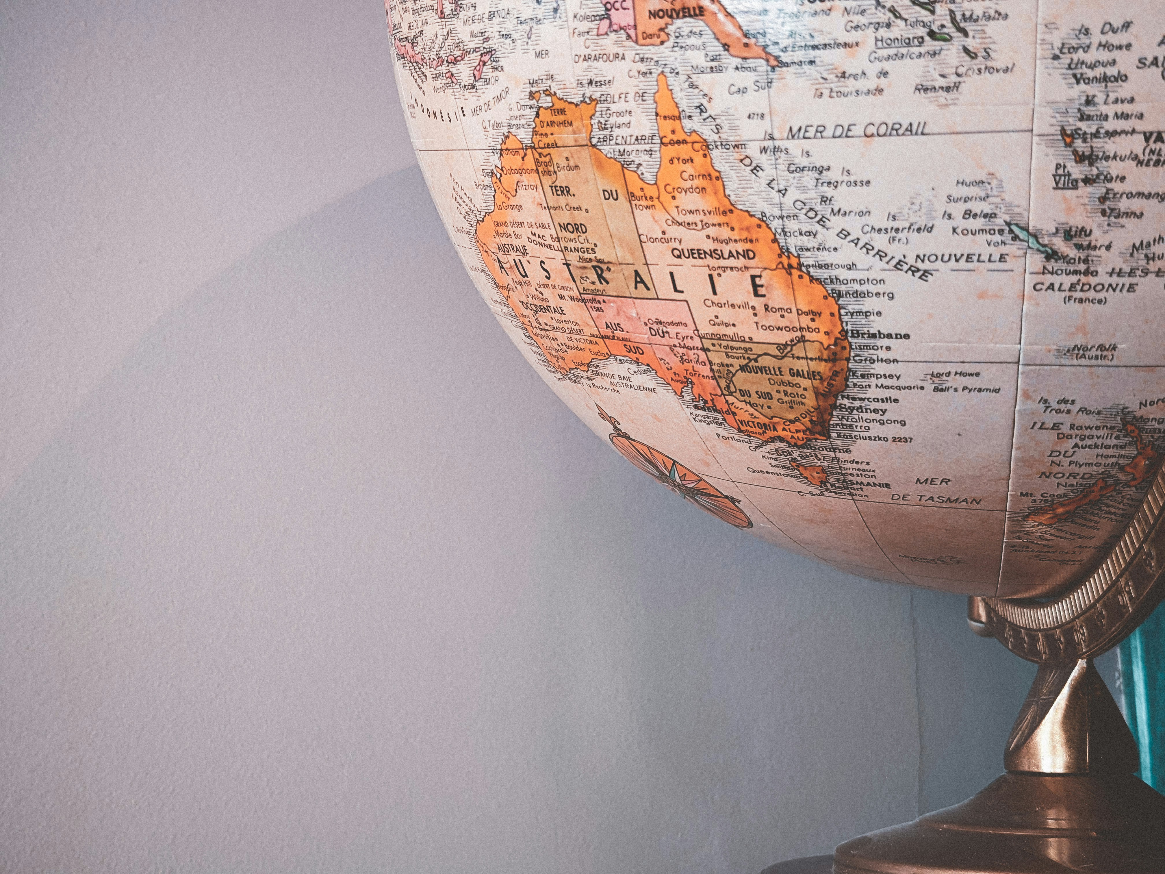 Photo of the bottom half of a globe, showing Australia and southeast Asia